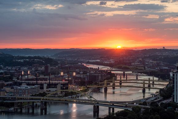 A glowing sunrise in Pittsburgh at dawn