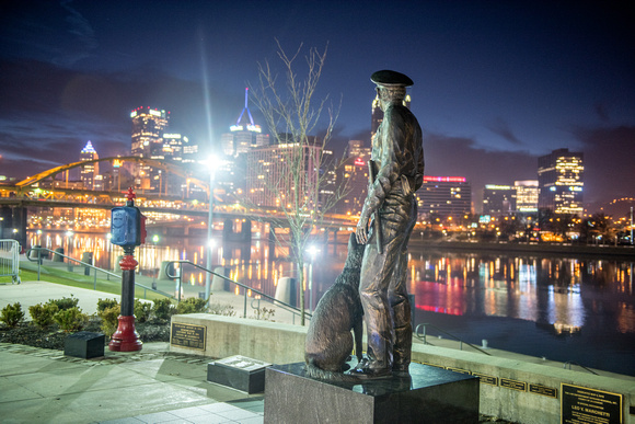 The Law Enforcement Memorial glows before dawn in Pittsburgh