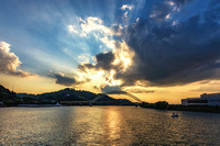 Sun bursts through the clouds over the Ohio River in Pittsburgh