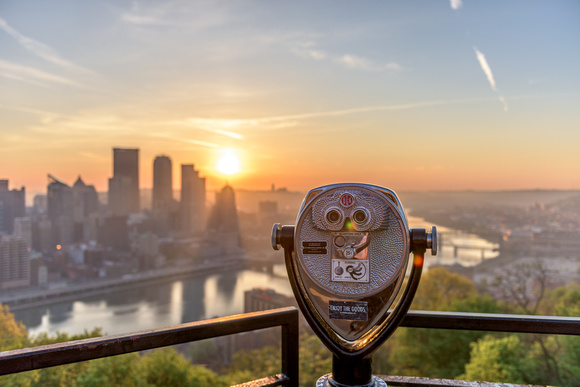 Sun shines bright behind a viewfinder on Mt. Washington in Pittsburgh