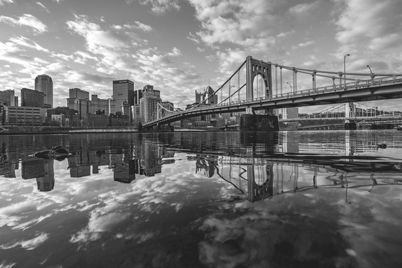 Pittsburgh and the clouds above reflect in the Allegheny