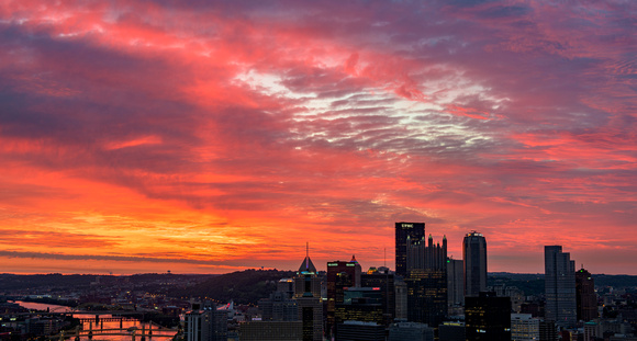 A light pillar at sunrise over Pittsburgh