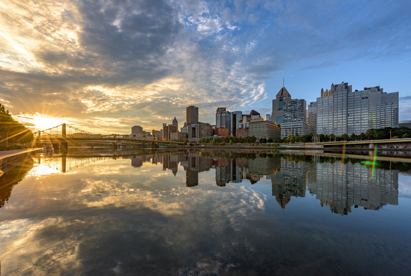 Pittsburgh and the sunrise reflects in the Allegheny River