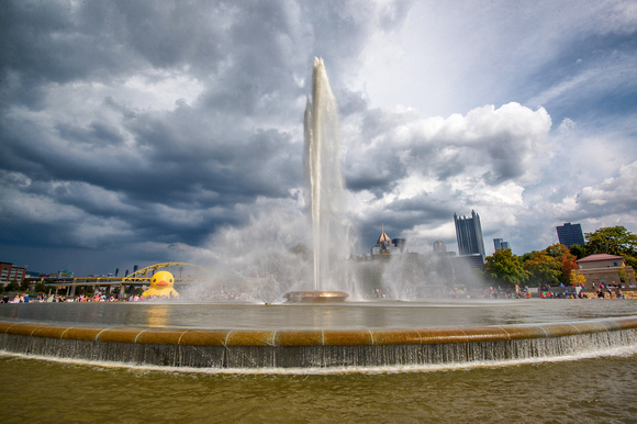 A dramatic sky over the Giant Rubber Duck and the fountain at Point State Park in Pittsburgh HDR
