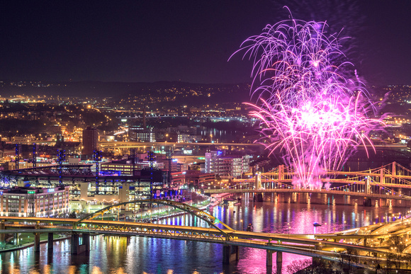 Fireworks reflect in the Allegheny River in Pittsburgh