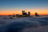 Waves of fog blanket the Pittsburgh skyline