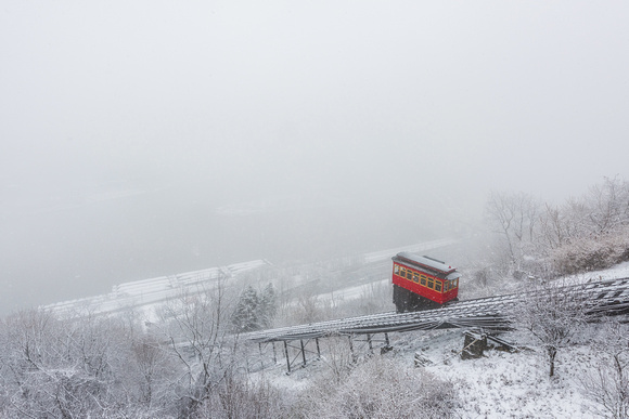 Downtown Pittsburgh disappears in the falling snow behind the Duquesne Incline