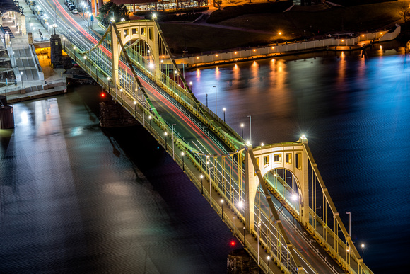 Cars streak over the Clemente Bridge in Pittsburgh