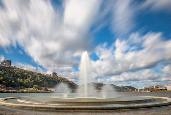 Clouds rush over the fountain at the Point in the fall in Pittsburgh