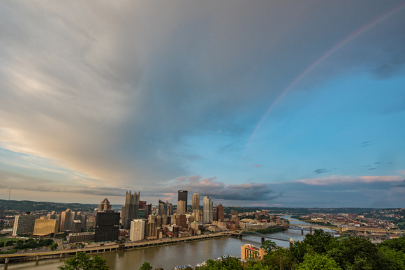 A rainbow falls over Pittsburgh after a storm