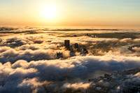 Aerial view of the Pittsburgh skyline covered in fog