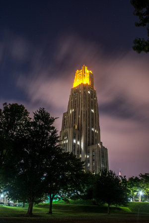 Clouds rush over the Victory Lights on the Cathedral of Learning after the Pitt vs. Penn State Game