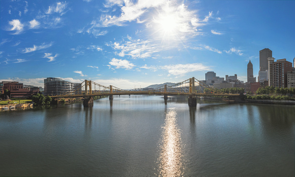Panorama of the sun rising over the Allegheny River in Pittsburgh