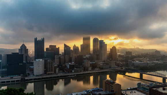 Sunlight glows through the low fog in Pittsburgh