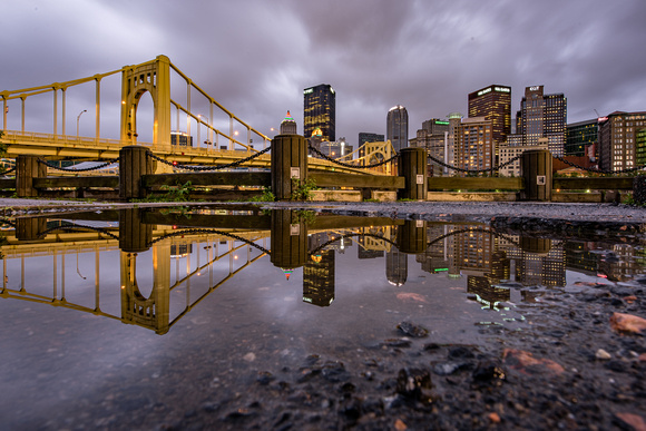 Pittsburgh reflects in the puddles after the rain