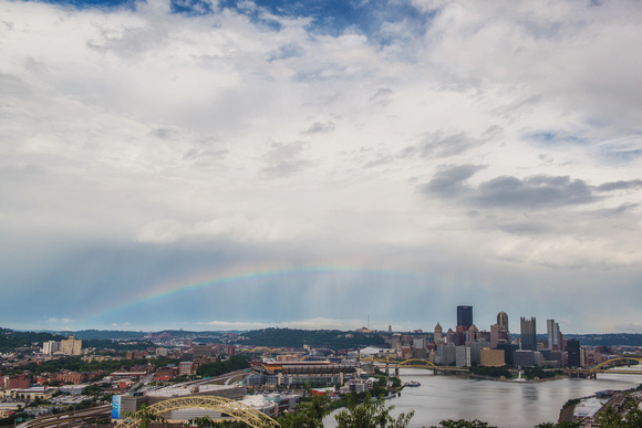 Blue skies and a rainbow over the Pittsburgh skyline