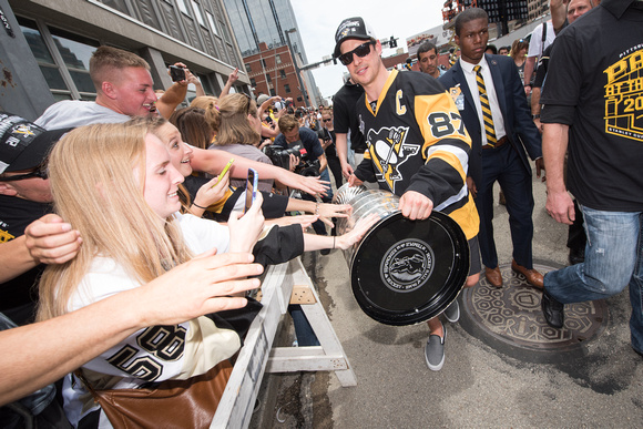 Sidney Crosby bringing the Stanley Cup by fans Pittsburgh Penguins Stanley Cup Parade - 213