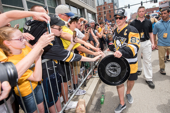 Sidney Crosby bringing the Stanley Cup by fans Pittsburgh Penguins Stanley Cup Parade - 212