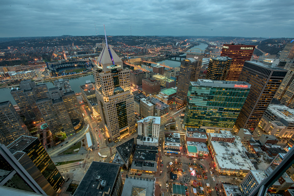 Pittsburgh glows at night from above the streets