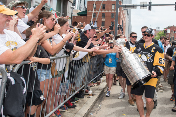 Sidney Crosby bringing the Stanley Cup by fans Pittsburgh Penguins Stanley Cup Parade - 211