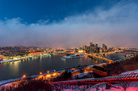 A snow squall moves through Pittsburgh above the Duquesne Incline