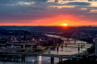 The sun glows as it crosses the horizon in Pittsburgh