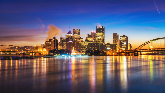 A vibrant Pittsburgh skyline before dawn