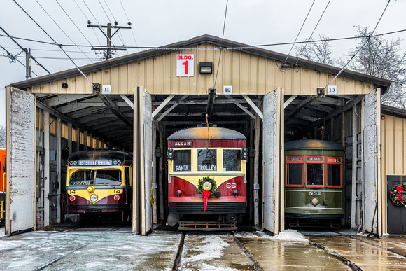 Trolleys at the Pennsylvania Trolley Museum sit in the snow and ice