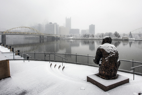 Snow sits on the Mr. Rogers Statue in Pittsburgh