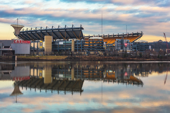 Heinz Field reflects in the river before the last regular season game