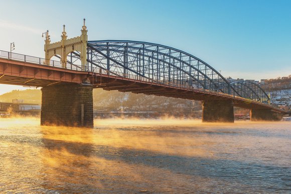 Steam rises from the Monongahela River in Pittsburgh under the Smithfield St. Bridge