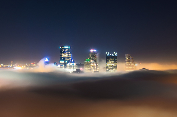 Pittsburgh emerges above the fog from the West End Overlook