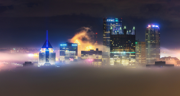 Fog is backlit by the lights of Pittsburgh from Mt. Washington
