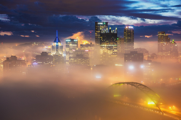 Downtown Pittsburgh glows through the fog in this early morning view