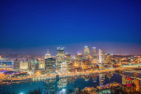 The Pittsburgh skyline lights up the blue night