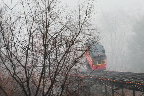 The Duquesne Incline rises through the fog in Pittsburgh