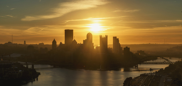 A vibrant sunrise over Pittsburgh from the West End