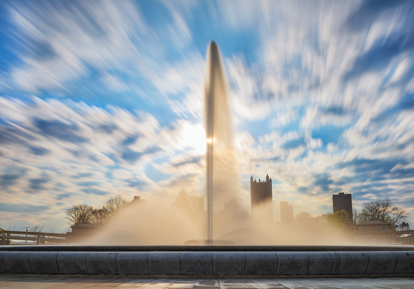 Clouds rush over the fountain at Point State Park in Pittsburgh