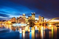 Downtown Pittsburgh glows from the banks of the horizon just before dawn