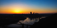 The sun glows on the horizon before dawn in Pittsburgh