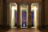 Pillars from the Lincoln Memorial frame the Washington Monument