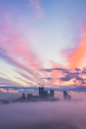 A colorful sunrise above the fog in Pittsburgh