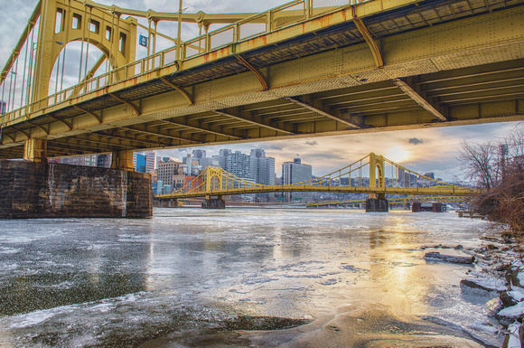 Under the Andy Warhol Bridge looking down the icy Allegheny River in Pittsburgh