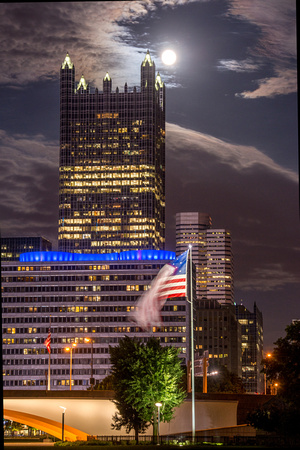 The supermoon, PPG Place and the American flag in Pittsburgh