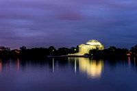 The Jefferson Memorial glows and reflects in the Tidal Basin in Washington DC