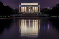 The Lincoln Memorial reflects int he Reflecting Pool in the middle of the night in Washington DC
