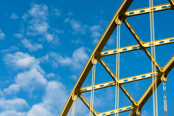 The Ft. PItt Bridge stretches into a blue sky in Pittsburgh