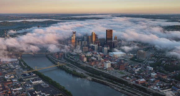 The wall of fog approaches Pittsburgh along the Ohio River
