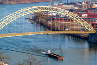 A barge under the West End Bridge in Pittsburgh