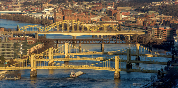 A barge on the rivers at dusk in Pittsburgh